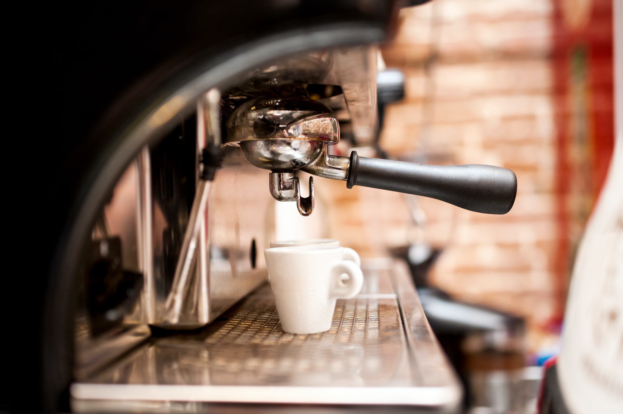 machine preparing espresso in coffee shop or bar